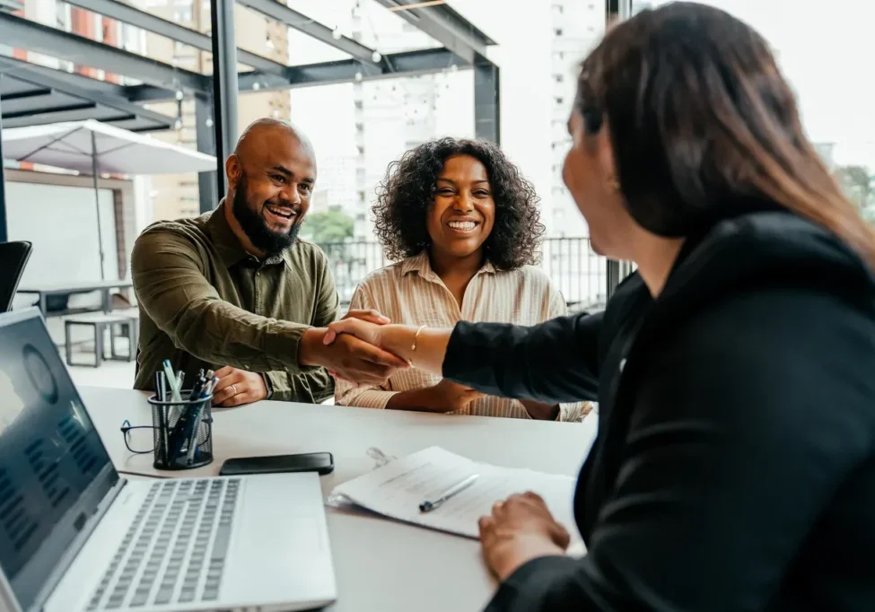Business meeting handshake across a table